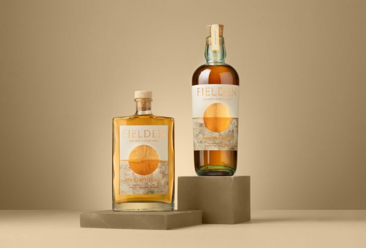 Still life photograph of 2 whisky bottles